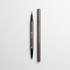Eyebrow stroke pen in soft brown used for microblading eyebrow strokes on a light grey background